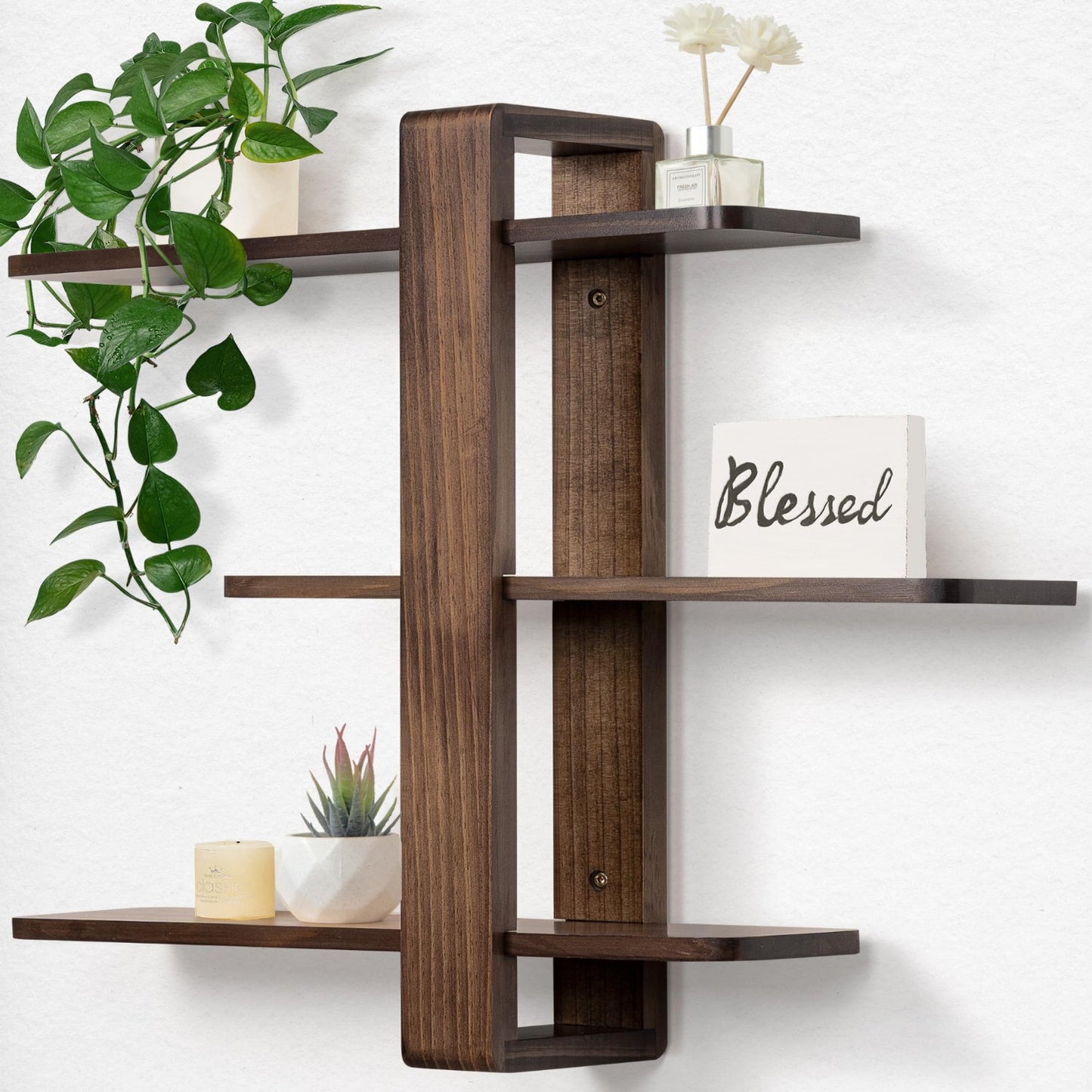 Wooden wall shelf with decorative items on a white wall