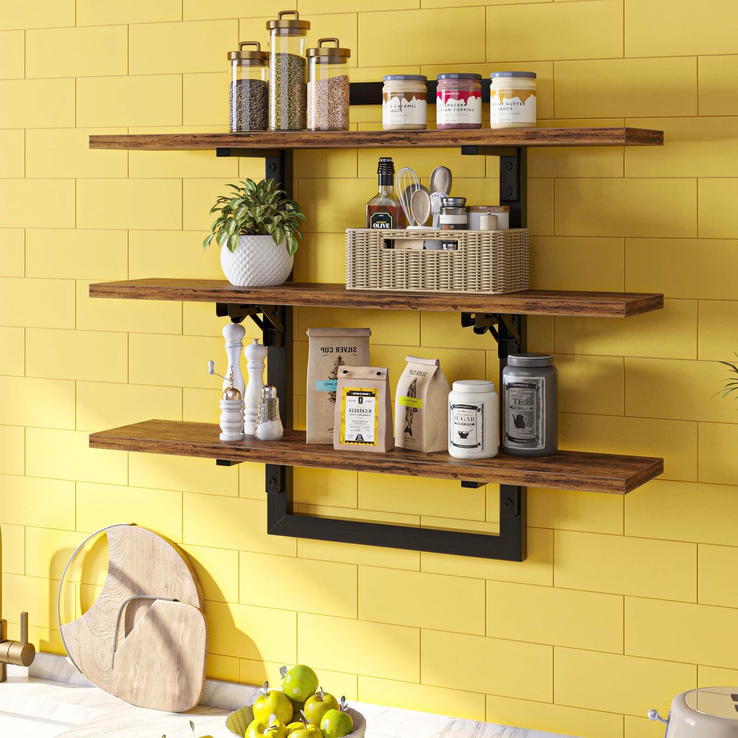 Wooden shelves with various items against a yellow tiled wall