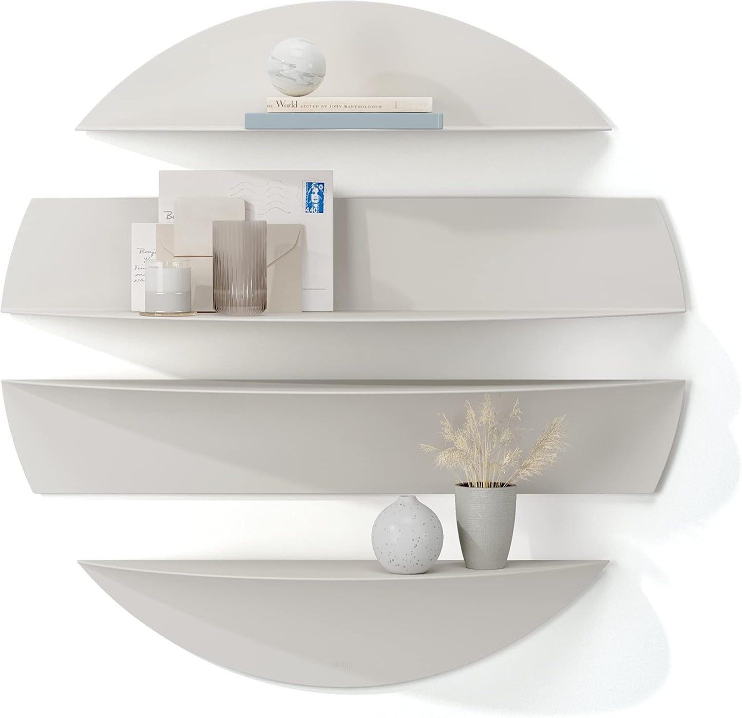 White wall-mounted shelf with decorative items on a white background