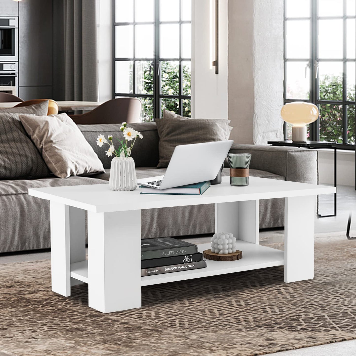 White coffee table with decorative items in a living room setting