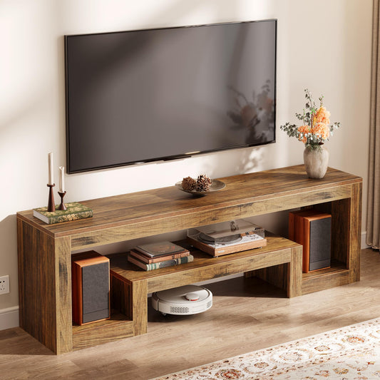 Wooden TV stand with a television mounted above it, featuring decorative items.