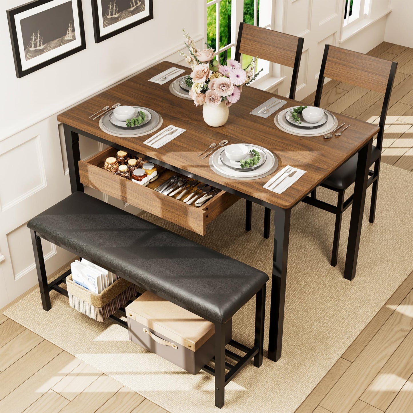 Dining table set with chairs, bench, and tableware in a room with large windows.