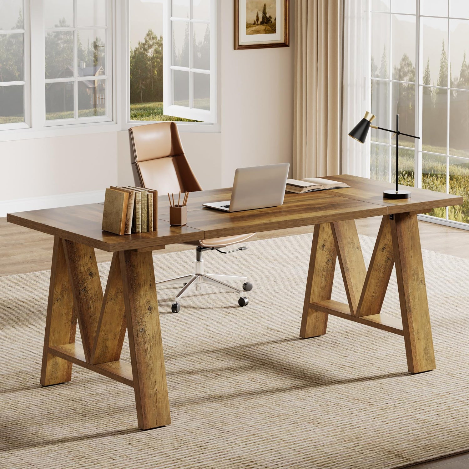 Wooden desk with chair and laptop in a bright room with large windows.
