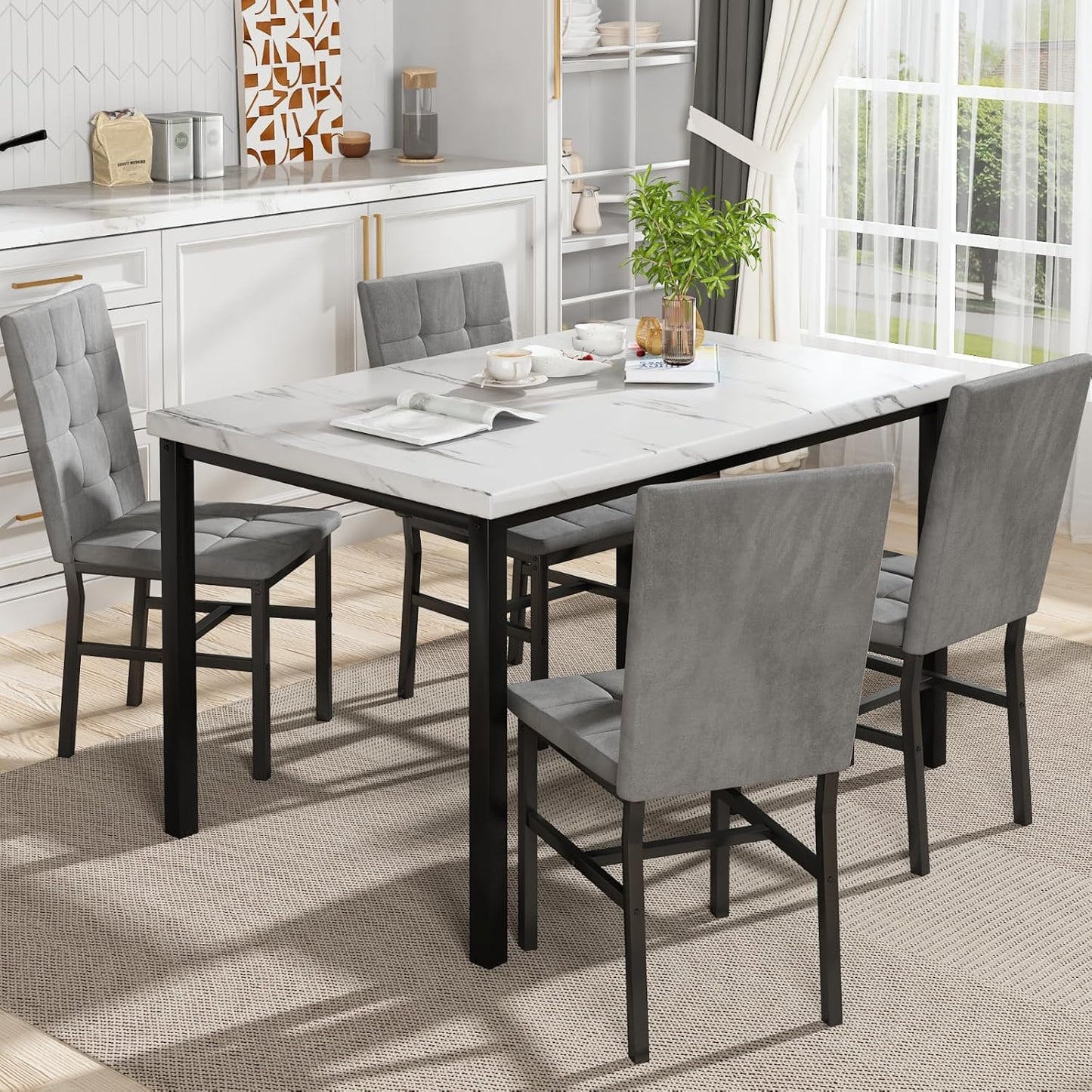 Dining table set with gray chairs in a modern kitchen.