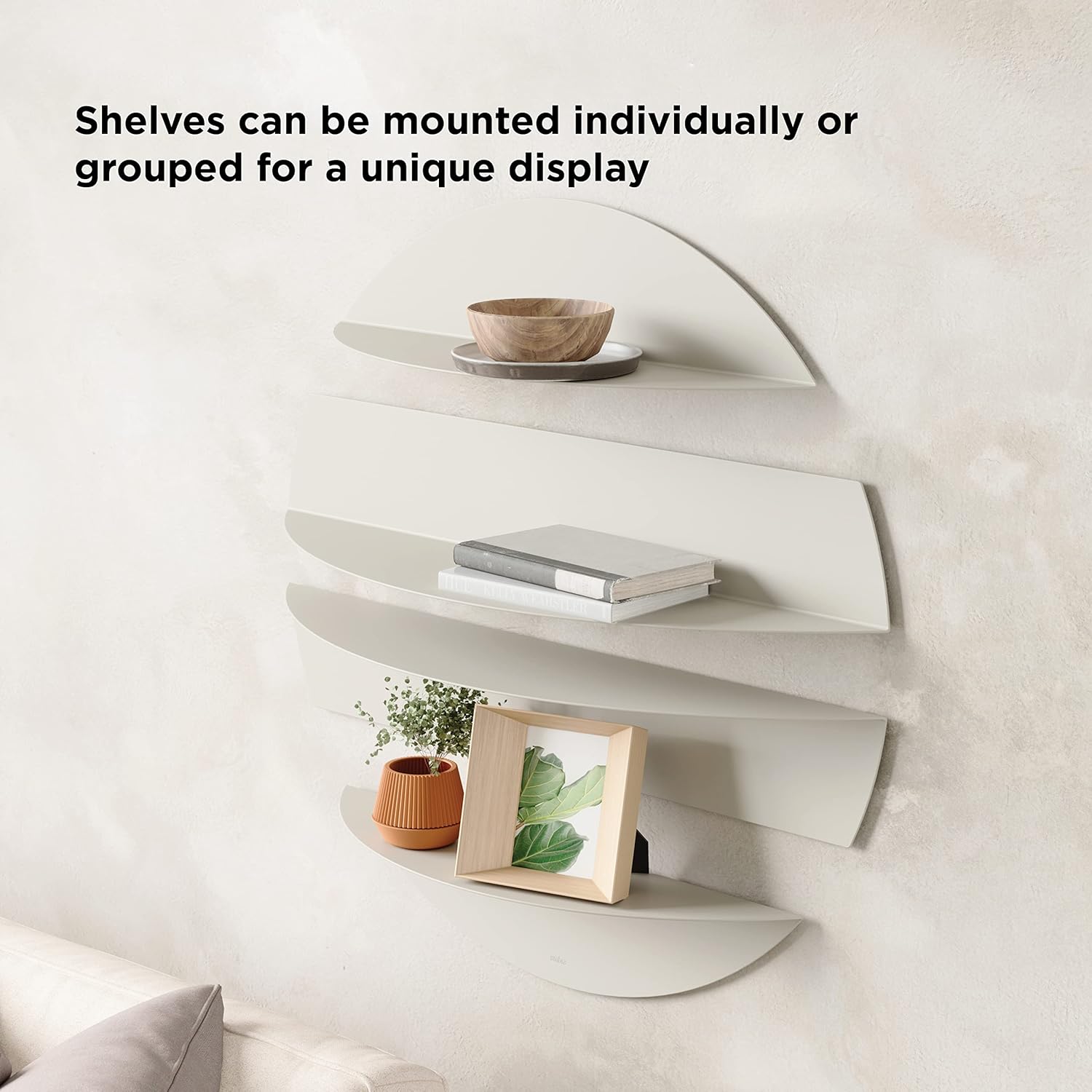 Wall-mounted shelves with decorative items on a neutral background