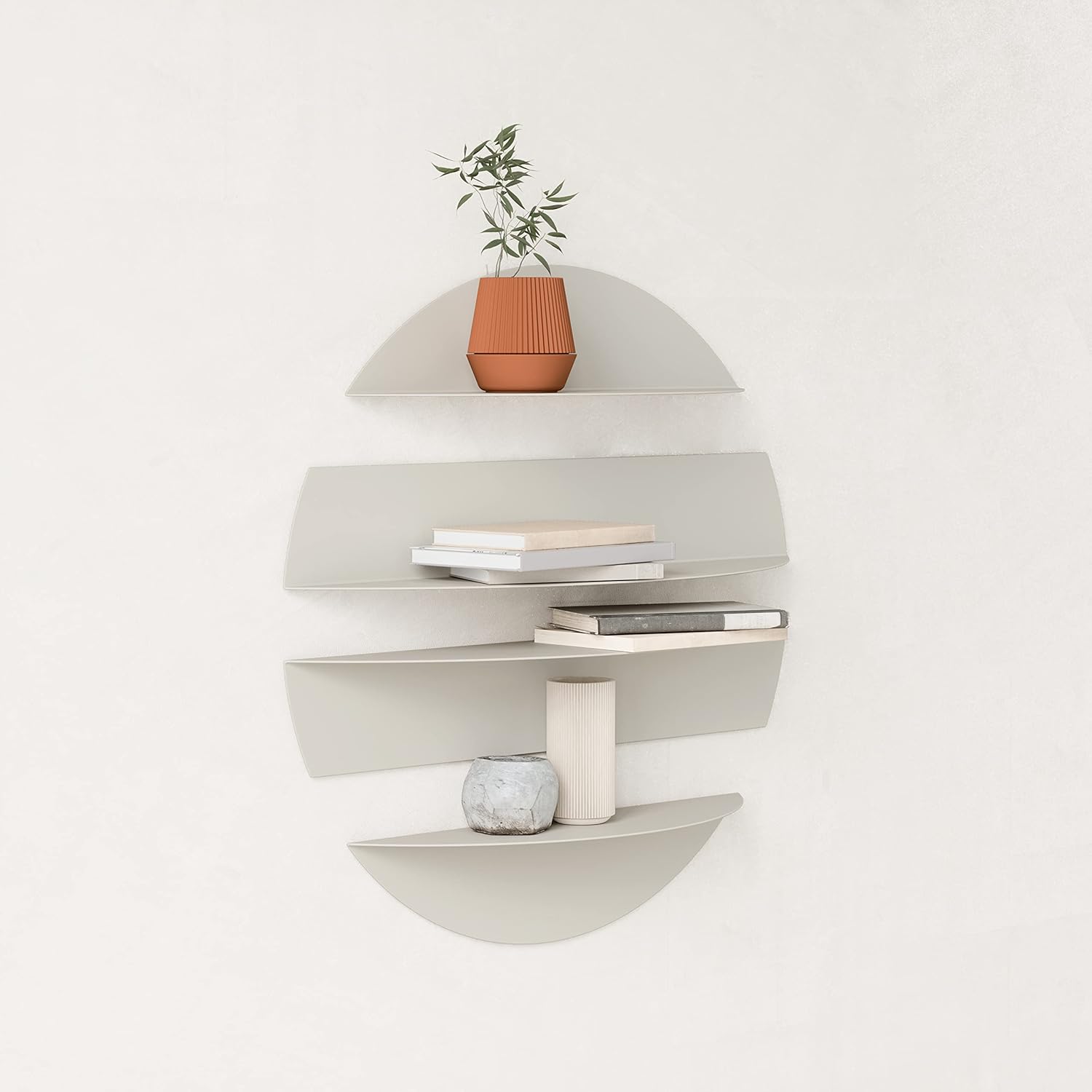 Modern wall shelf with books and a plant on a white background