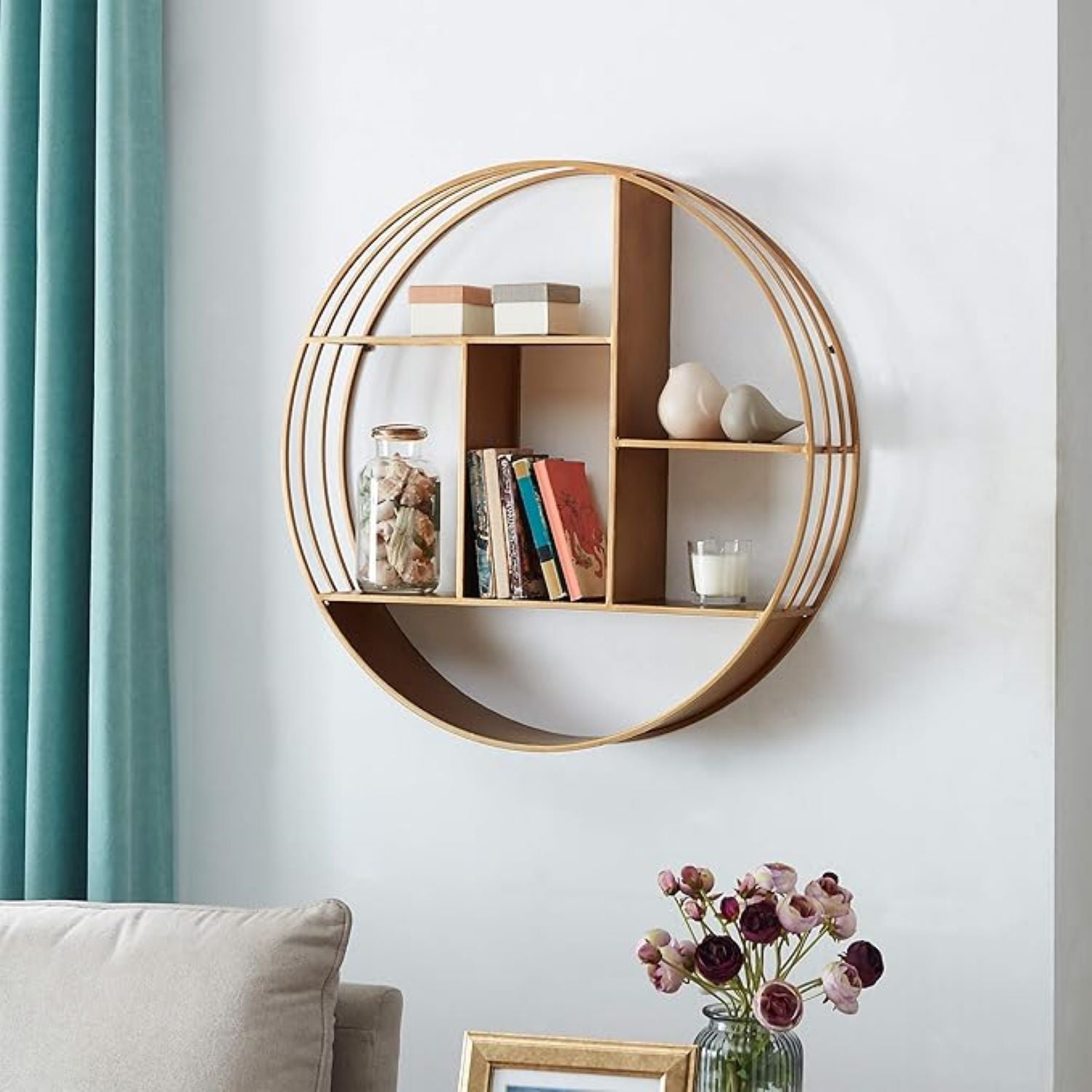 Round wooden wall shelf with decorative items against a light gray wall.