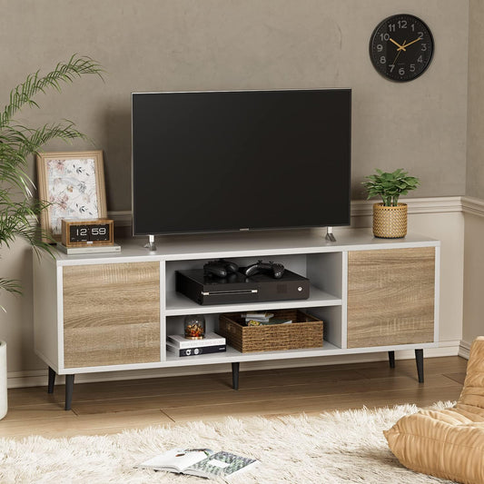 TV stand with a television, gaming console, and decorative items in a living room setting.