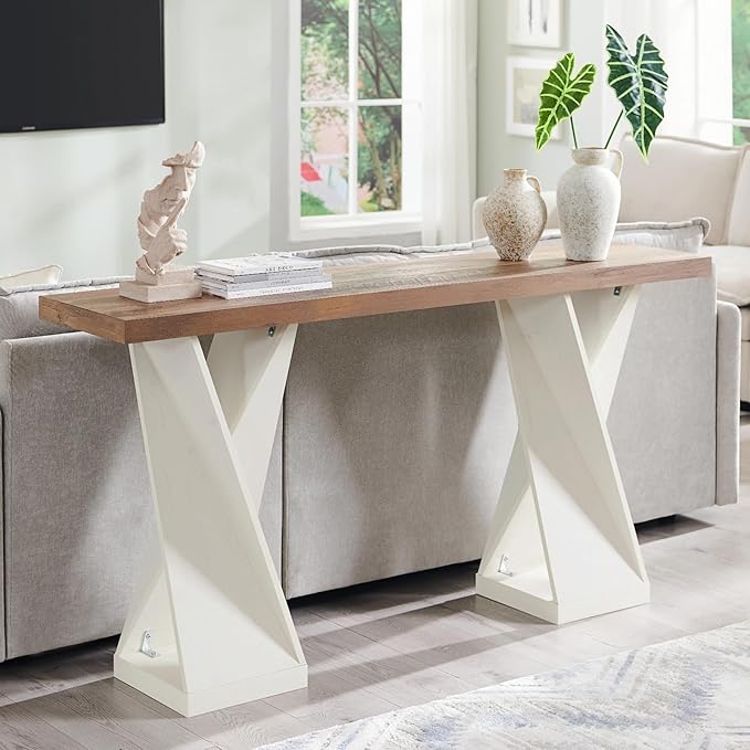 Modern console table with wooden top and white base in a living room setting.