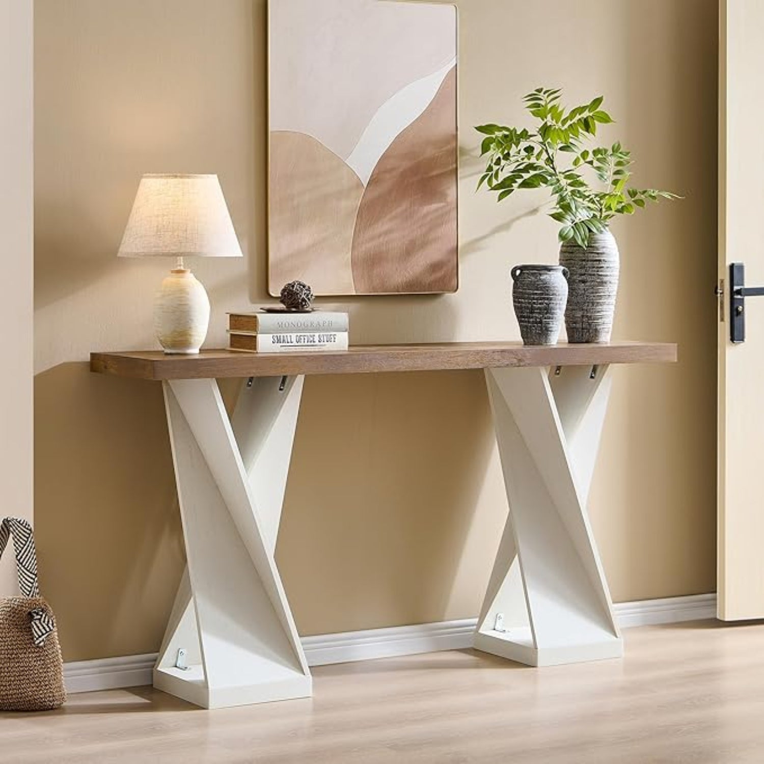 Console table with decorative items against a beige wall