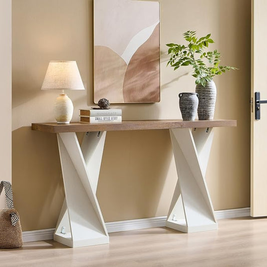 Console table with decorative items against a beige wall