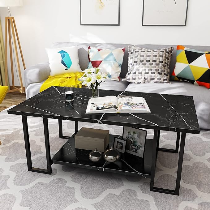 Modern living room with a black marble coffee table, colorful pillows, and a sofa.