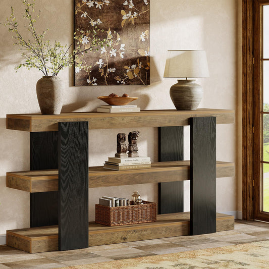 Wooden console table with decorative items in a room with a painting and lamp.