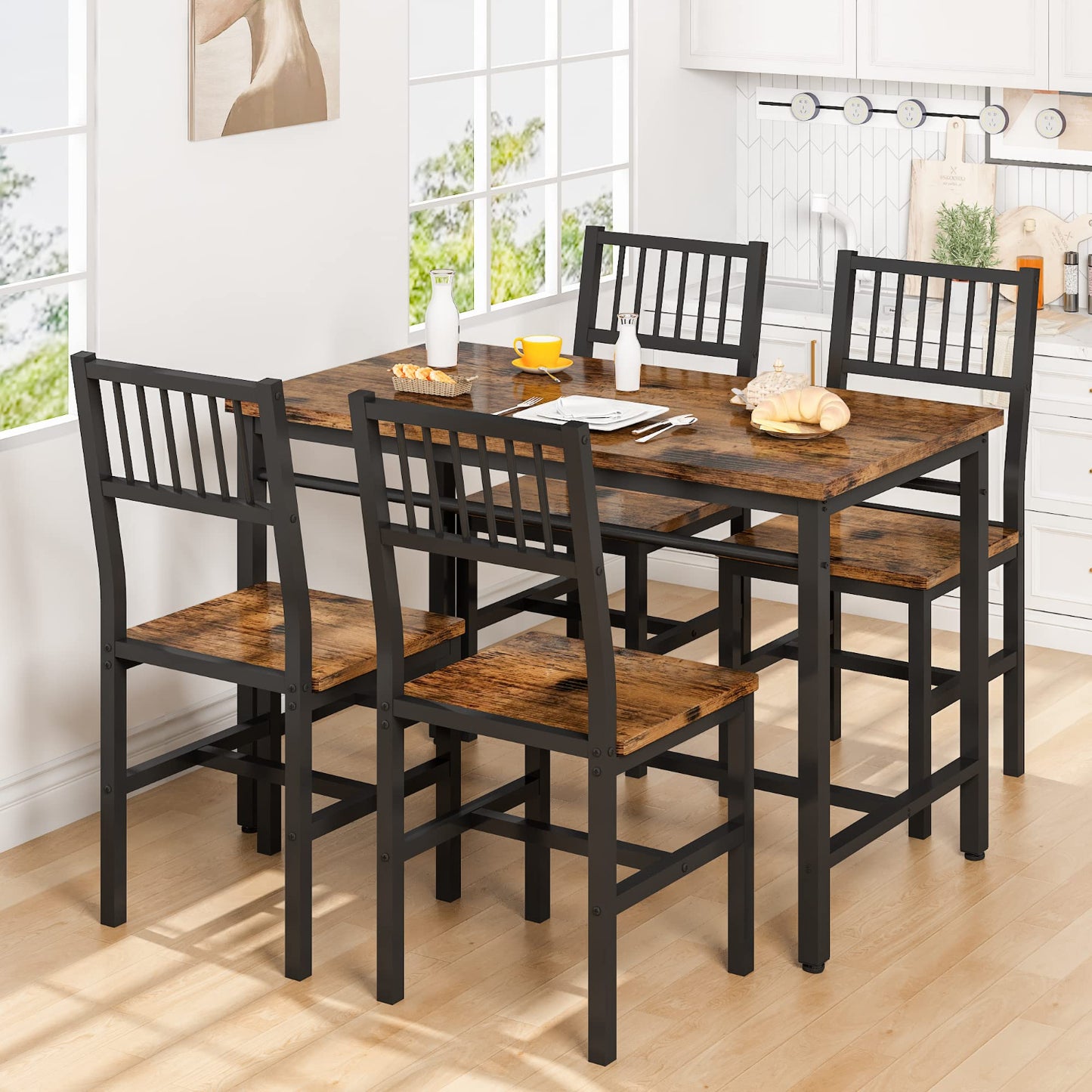 Dining table set with four chairs in a bright room