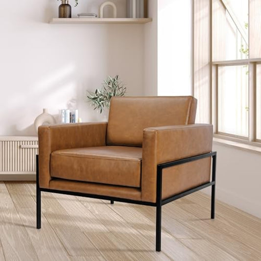 Brown leather armchair in a room with a window and shelves.