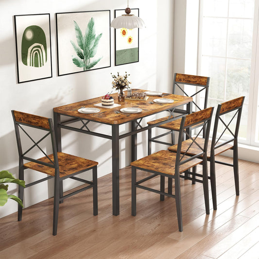 Dining table set with chairs in a room with framed artwork on the wall.