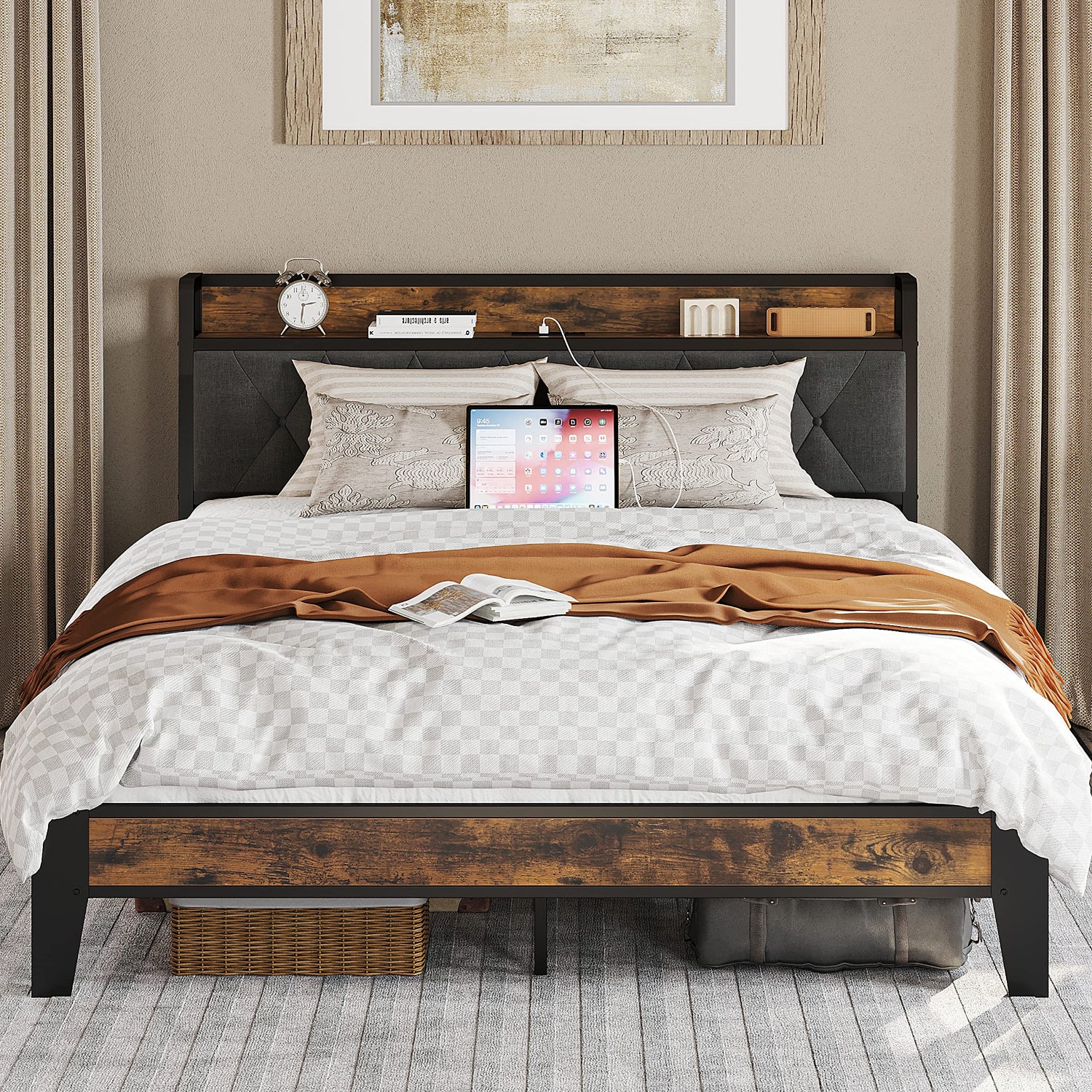 Bedroom with a wooden bed frame, gray upholstered headboard, and decorative elements.