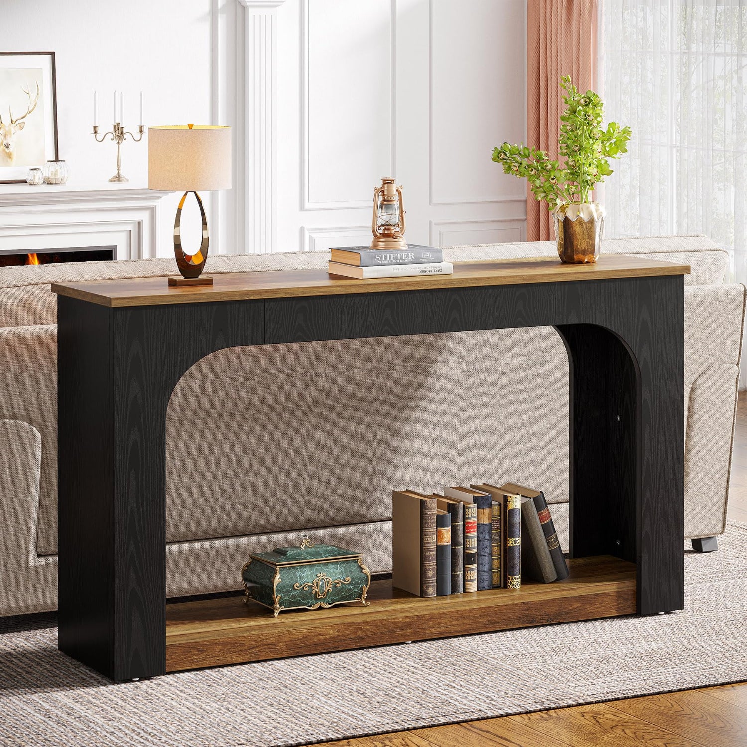 Console table with books and decorative items in a living room setting