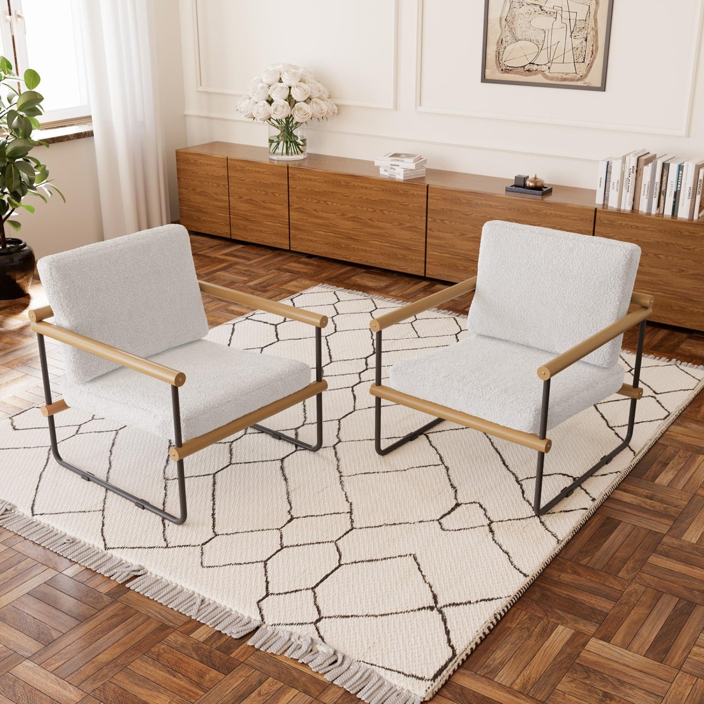 Two modern chairs with wooden frames on a geometric-patterned rug in a living room.