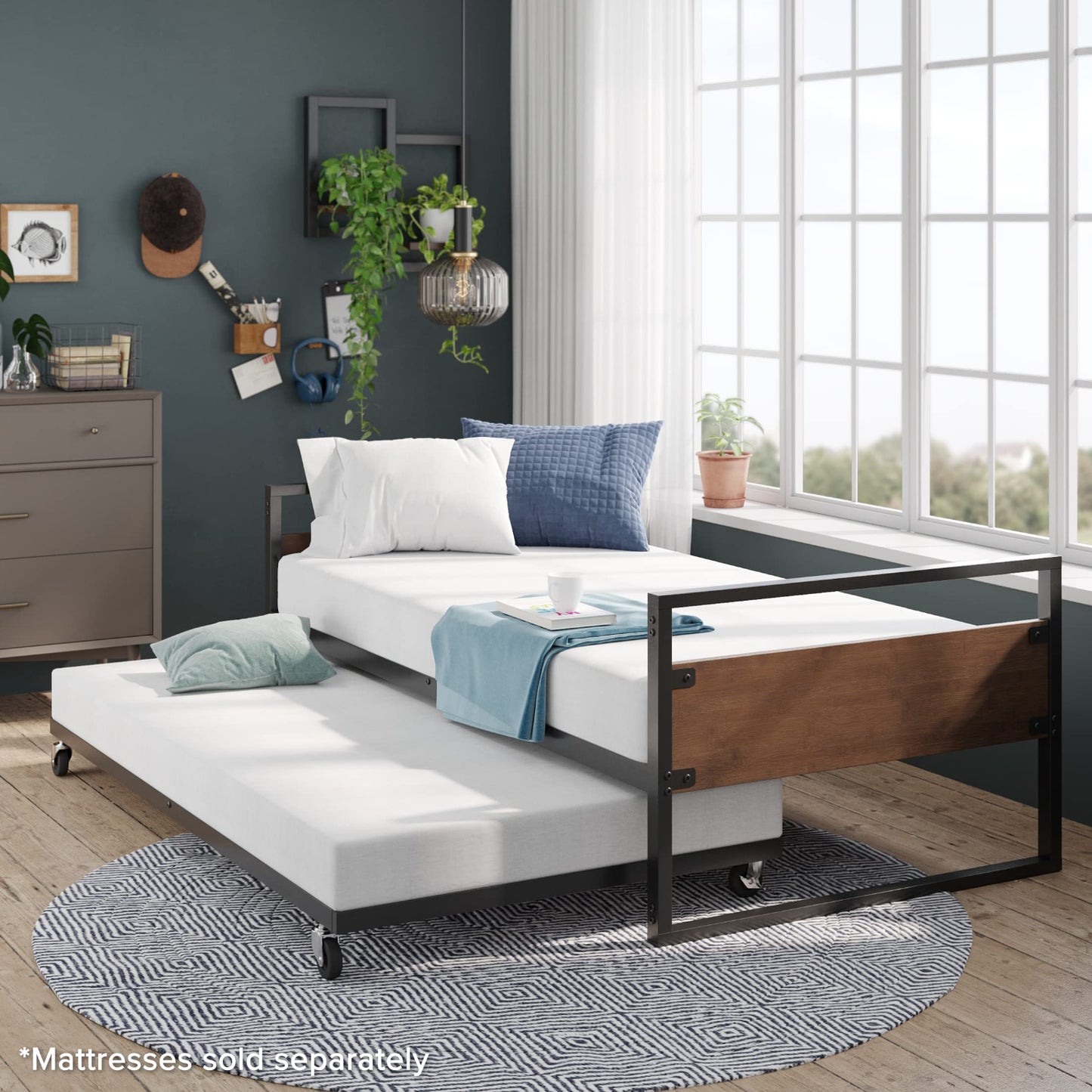 Modern bedroom with a trundle bed and dresser.