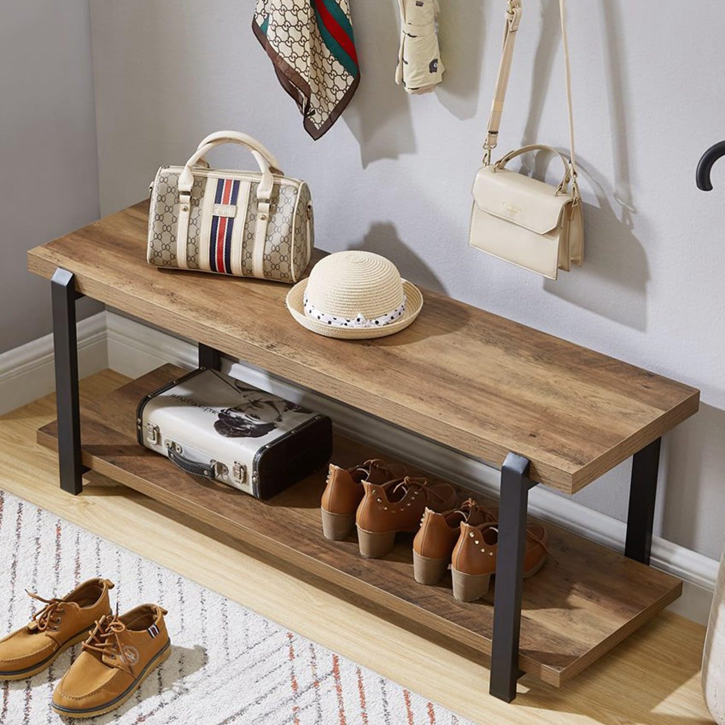 Wooden bench with shoes, handbags, and a hat in a room setting.