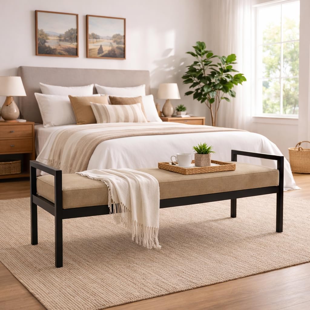 Bedroom with a bed, bench, and decor elements